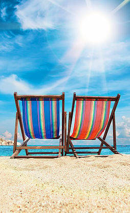 two beach chairs in the sun